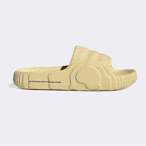 Vibrant adidas adilette 22 slides with magic lime and desert sand colors